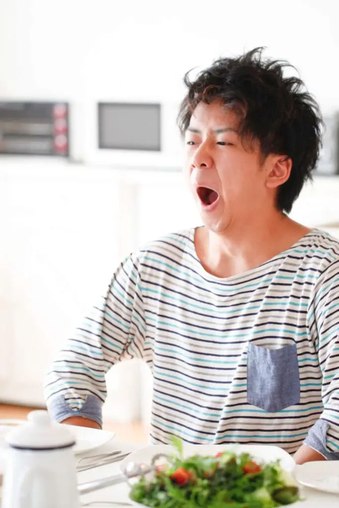 a man yawning because lack of motivation